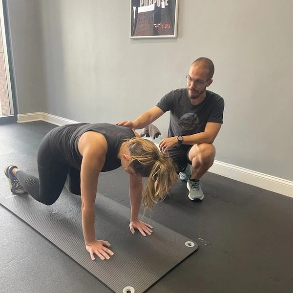 Coach showing the exercise